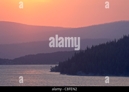 Red sky over St. Mary Lake at sunrise, Glacier National Park, Montana, United States of America Stock Photo