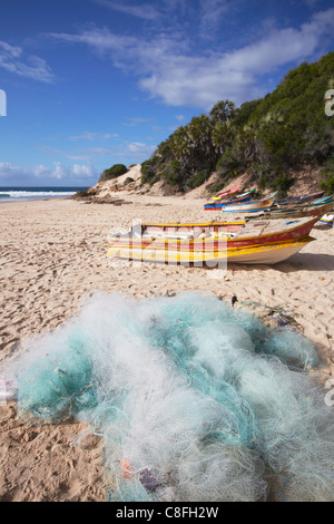 Fishing boats and nets on beach, Tofo, Inhambane, Mozambique Stock Photo