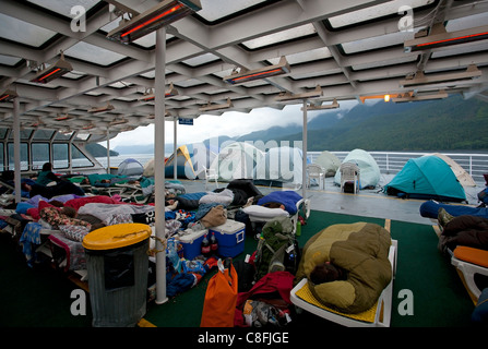 Passenger sleeping in the solarium. Columbia ferry. Alaska Inside Passage. USA Stock Photo