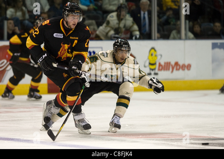 London Ontario, Canada - October 23, 2011. Andreas Athanasiou (86) of the London Knights poke checks the puck away from the Belleville Bulls Brady Austin (22) in their game. London won the game 4-0. Stock Photo