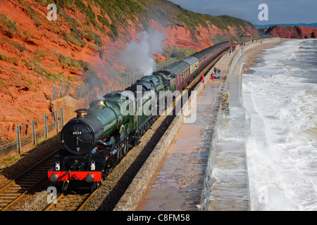 The Devonian double headed by steam locomotives 6024 King Edward I and 70013 Oliver Cromwell approaches Dawlish south Devon UK Stock Photo