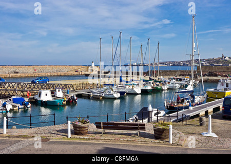 View over Banff marina harbour with moored  leisure vessels and to Macduff across the mouth of River Deveron Stock Photo