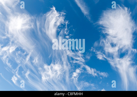 wispy white streaky cirrus clouds with a blue sky behind them Stock ...