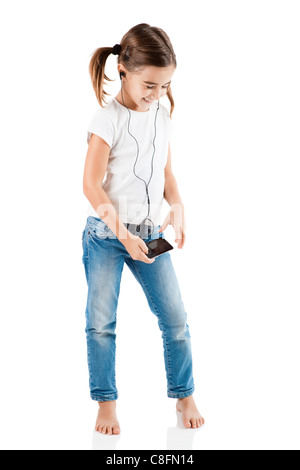 Little girl listen music with a MP3 player, isolated on white Stock Photo