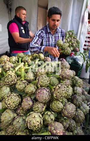 Artichokes displayed in stall at street market show Italy Italian Mediterranean Stock Photo