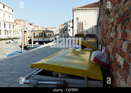 Rubbish bin and canal, Venice Italy Stock Photo