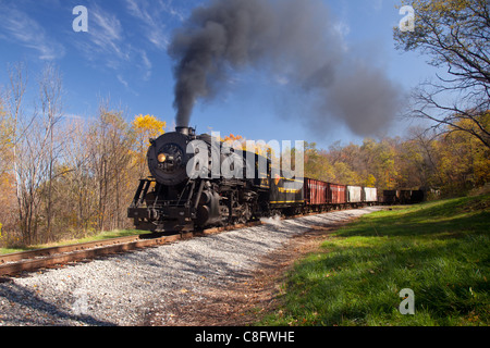 Western Maryland steam train running between Cumberland and Frostburg powers up the incline under full steam Stock Photo