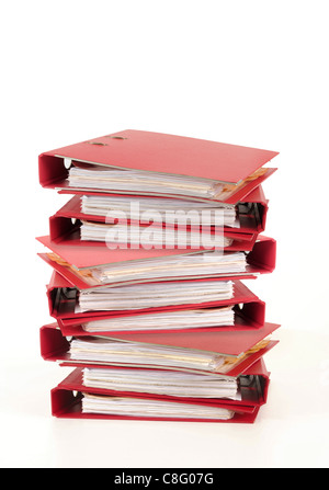 staple of folders, as symbol for paperwork,isolated over white. Stock Photo