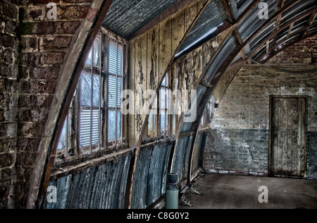 HDR interior view of a disused Nissen Hut. Stock Photo