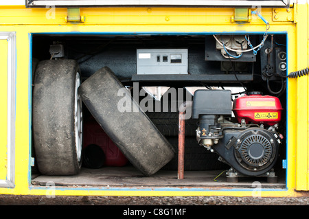 Tires and compressor into a track Stock Photo