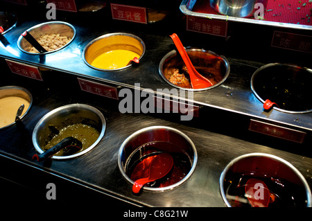 Various sauces at Hai Di Lao hot pot restaurant in Beijing, China. 21-Oct-2011 Stock Photo