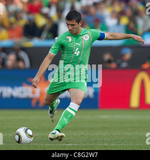 Algeria team captain Anther Yahia passes the ball during a 2010 FIFA World Cup Group C match against the United States. Stock Photo