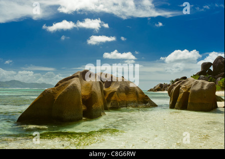 dramatic rock formations  along tropical beach Stock Photo