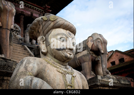The stone figure of Jayamel guards the bottom plinth of the Nyataploa Temple in Bhaktapur, Nepal, Asia Stock Photo