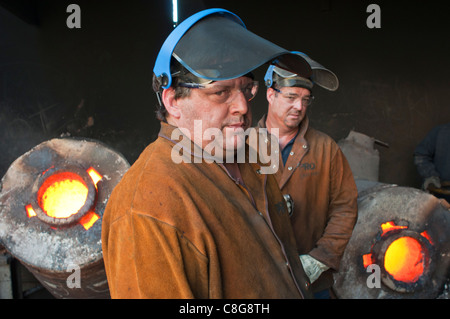 Foundry workers in small metal casting foundry in Perth Western Australia Stock Photo