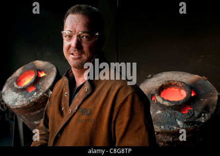 Foundry workers in small metal casting foundry in Perth Western Australia Stock Photo