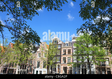Houses along a canal, Amsterdam, Netherlands Stock Photo