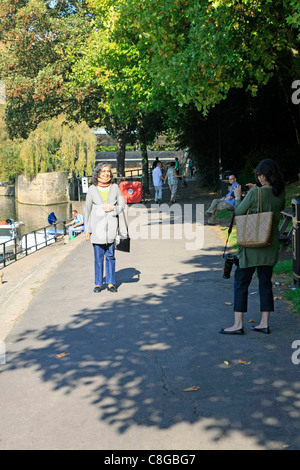 Asian Mother and Daughter taking part in a Photo Opportunity in Bath Stock Photo