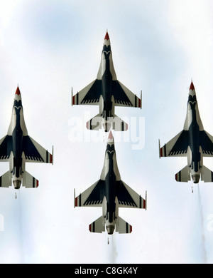 Four Air Force Thunderbird F-16 Fighting Falcons fly together in formation for more than 6,000 spectators during the June 24 airshow at Eielson Air Force Base, Alaska. The 'Soaring into Soltice' airshow provided an opportunity for the local community to visit and get an up close view and demostration of the capabilities of the Air Force's aircraft. Stock Photo