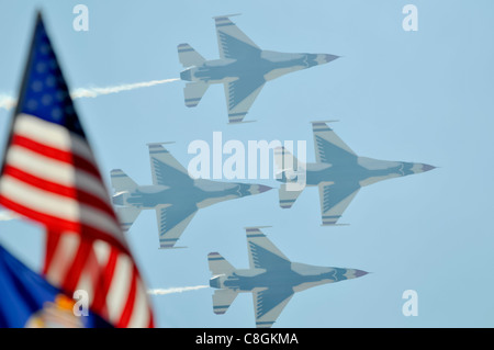 The U.S. Air Force air demonstration team, the Thunderbirds, perform precision aerial maneuvers Nov. 6, 2010, during AirFest 2010 at Lackland Air Force Base, Texas. Stock Photo