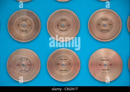 Some of the gold disks on display on the Liverpool Wall of Fame on Mathew St Liverpool, Liverpool, England. Stock Photo