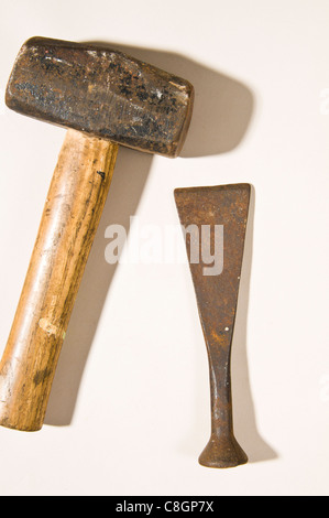 Old rusty Lump Hammer & Masonry Chisel Stock Photo