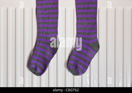 Stripey socks on a radiator Stock Photo