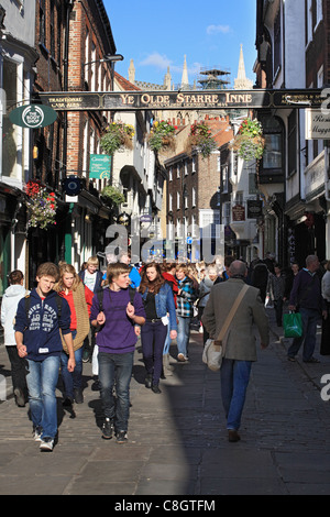 people-walking-along-stonegate-in-york-north-yorkshire-england-stock