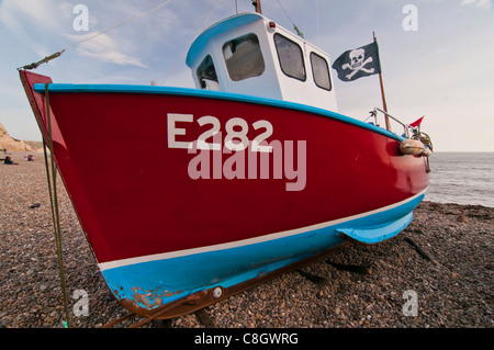 Fishing boat on a beach in Devon Stock Photo