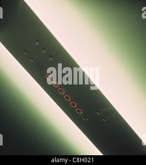 A glowing interior elevator panel with buttons. Stock Photo