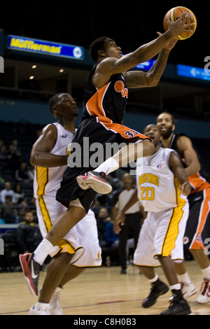 London Ontario, Canada - October 23, 2011. Jahaziel Howard of the Oshawa Power goes up for a basket during a National Basketball League of Canada game against the London Lightning. London won the game 111-83. Stock Photo