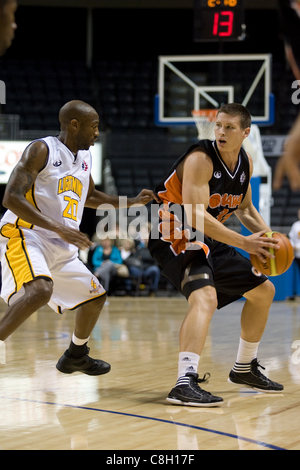 London Ontario, Canada - October 23, 2011. E.J. Kusnyer (31) of the Oshawa Power works against Eddie Smith (20) of the London Lightning during their game. Stock Photo
