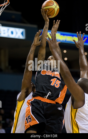 London Ontario, Canada - October 23, 2011. Jahaziel Howard (15) of the Oshawa Power goes up for basket in a game against the London Lightning. London won the game 111-83. Stock Photo