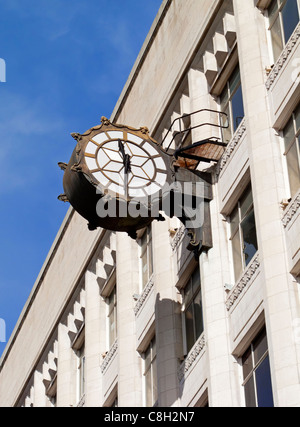 Clock outside Debenhams department store in Manchester England UK Stock Photo