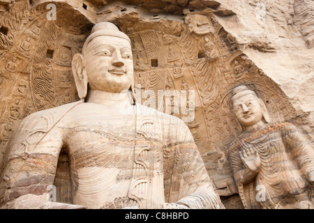 buddha statues at Yungang grottoes which is one of the largest - scale ancient grottoes in China. Stock Photo