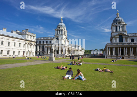 Visitors enjoy summer sunshine, Old Royal Naval College, built by Sir Christopher Wren, Greenwich, London, England, UK, United K Stock Photo
