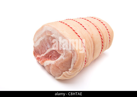 A joint of rolled belly pork trussed up with striped string. Stock Photo