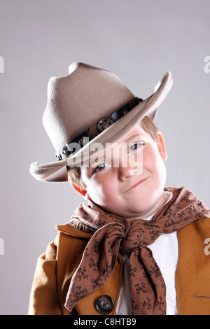 A smiling happy young cowboy with his head tilt Stock Photo