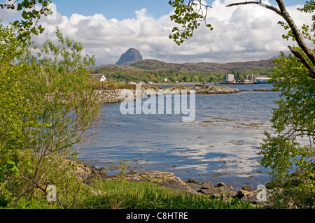 Lochinver on the north west coast of Scotland, with the distant peaksof Suilven. Stock Photo