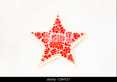 Papier-mâché star against a white background Stock Photo