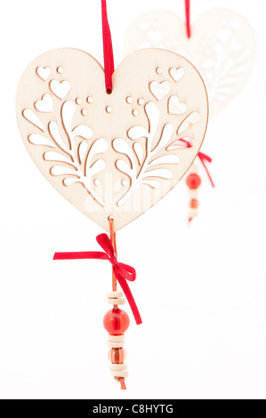 White heart-shaped decorations against a white background Stock Photo