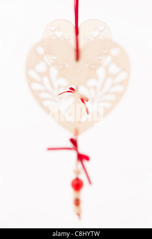 White heart-shaped decorations against a white background Stock Photo