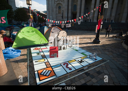 Anti capitalist protest camp and spoof Monopoly board game outside St Paul's Cathedral in the City of London, UK, on Tuesday, 25th October, 2011. Stock Photo