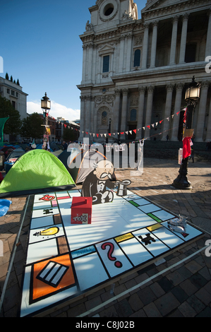 Anti capitalist protest camp and spoof Monopoly board game outside St Paul's Cathedral in the City of London, UK, on Tuesday, 25th October, 2011. Stock Photo