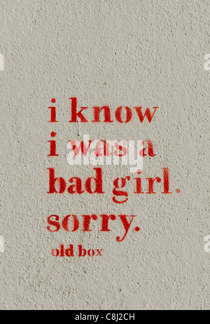 Graffiti on a Wall 'I know I was a bad girl. Sorry' Stock Photo