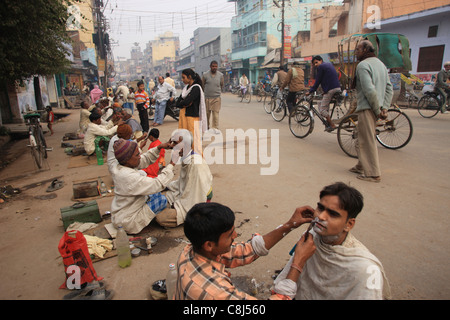 Street life, India, Asia, daily life, everyday, crowded, traffic, bicycles, barber, rickshaws, Indian daily life, Indian Stock Photo