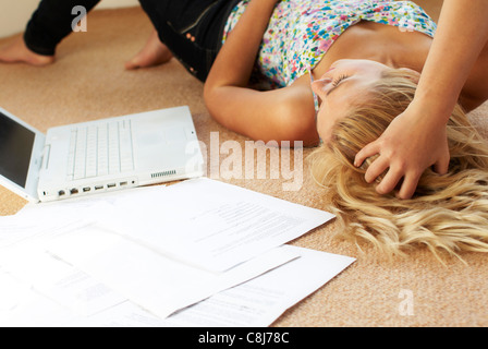 Worried looking girl with papers Stock Photo