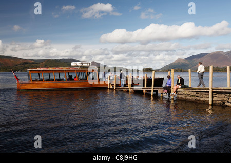 Tourists boarding [ferry boat] at jetty for leisure cruise, 'Derwent Water', [Lake District National Park], Cumbria, England, UK Stock Photo