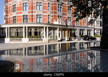 Front luxury five star Connaught Hotel exterior reflection Mayfair 'Silence’ raised water feature & tree by Tadao Ando Carlos Place London West End UK Stock Photo