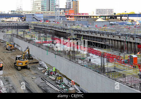 Canary Wharf Crossrail train station work in progress on building construction site in cofferdam West India Docks Isle of Dogs East London England UK Stock Photo